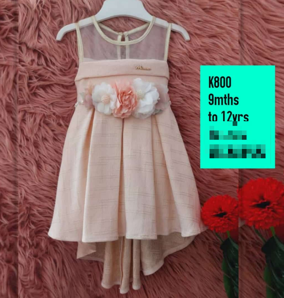 pink dress with flowers on the belt