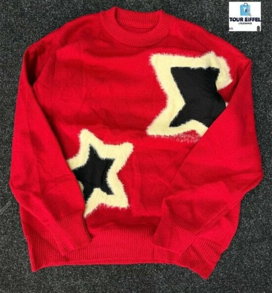 Pull rouge à motifs étoiles