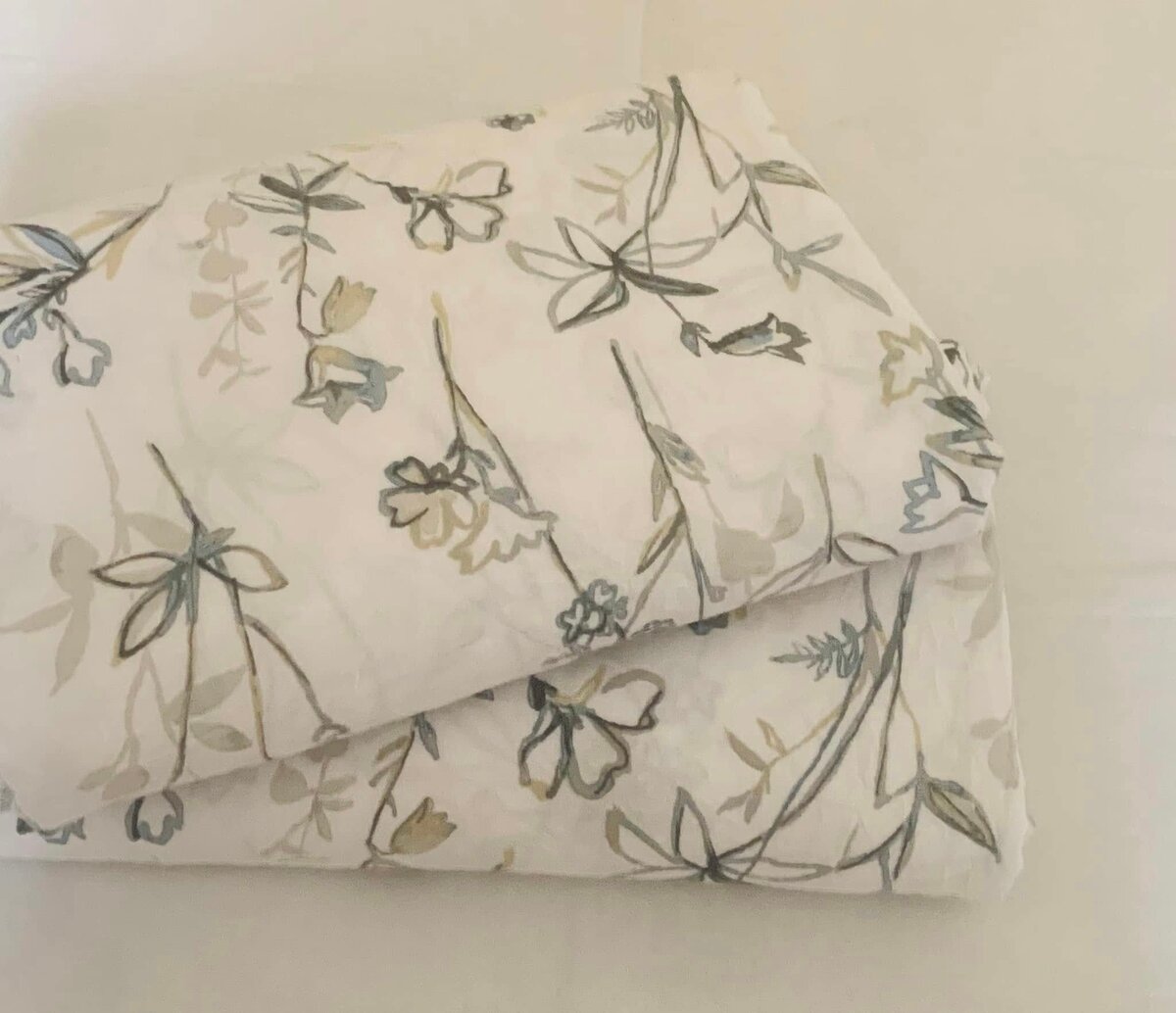 A set of sheets with a floral pattern in pastel colors
