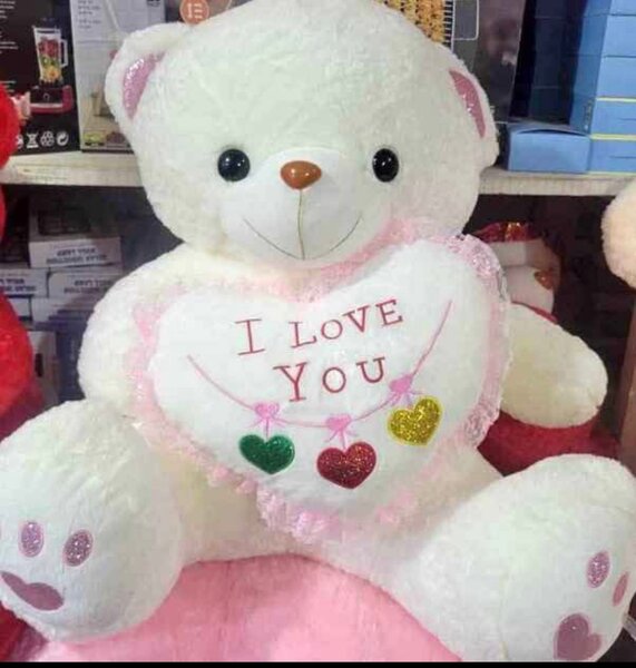 Gros ours en peluche blanc avec coeur