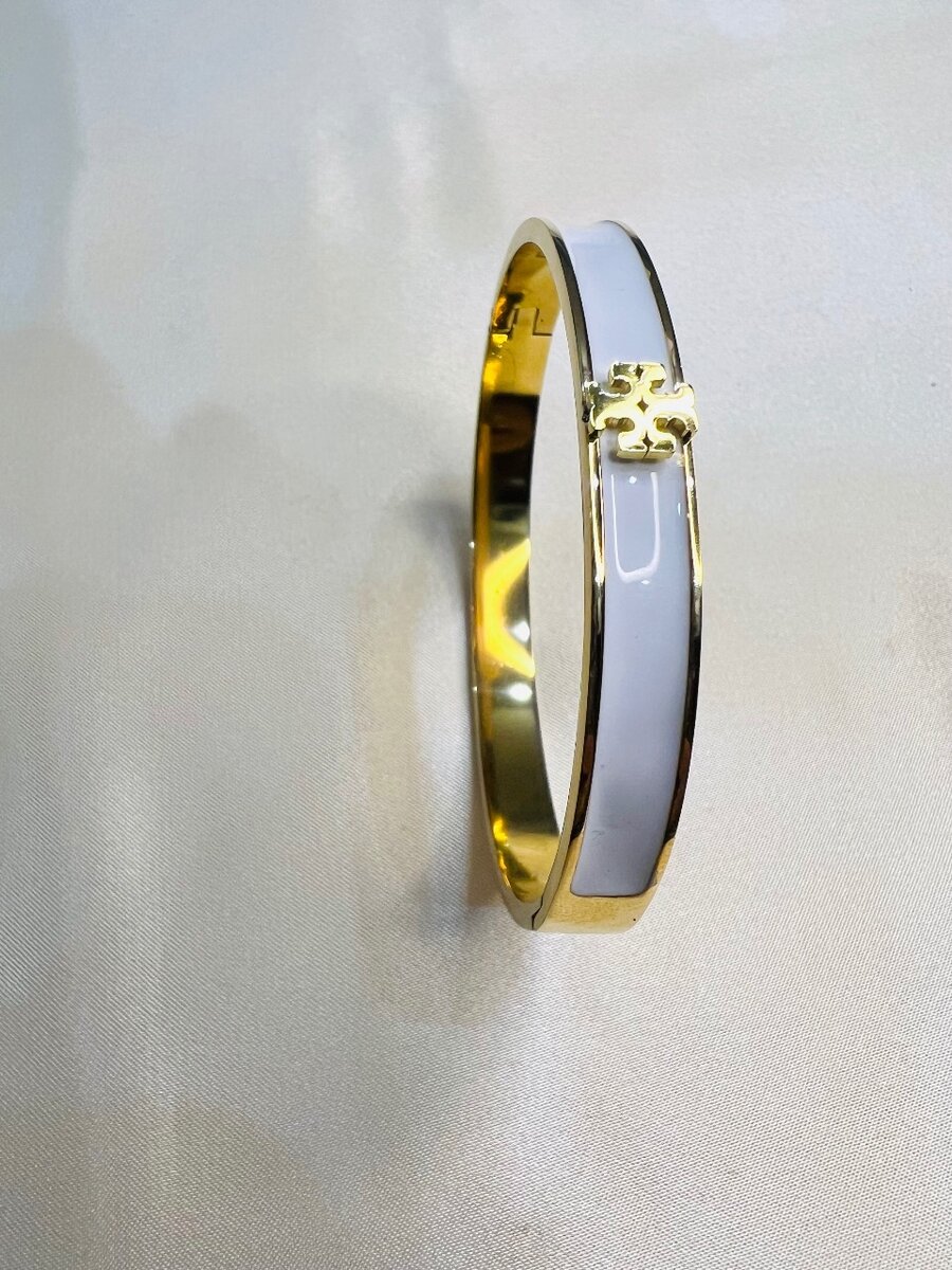 White and gold handcuff for girls.