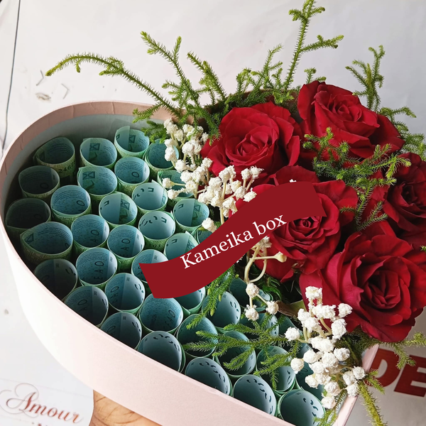 Bouquet de fleurs et billets