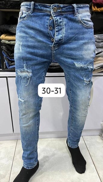 Jeans déchirés homme