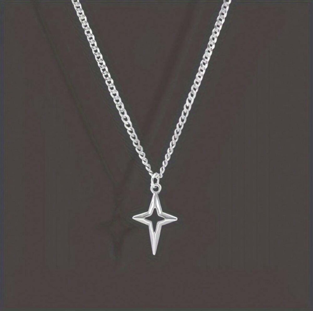 Star crossed pendant necklace