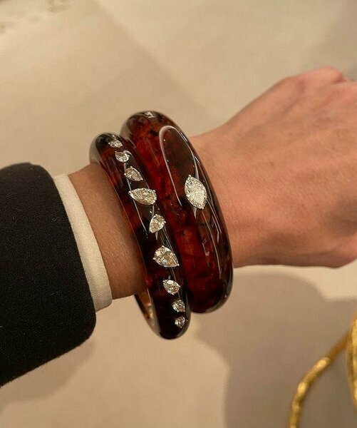 Brown bracelets with silver leaf details