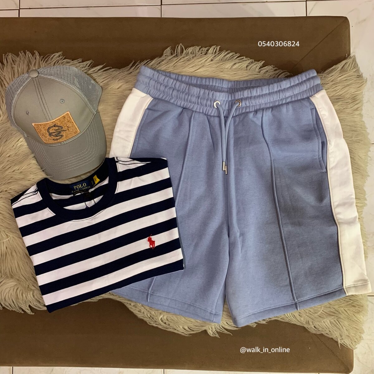 One polo t-shirt, one short sweatpant and a cap