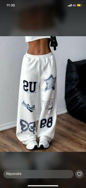 Pantalon ample blanc avec imprimés