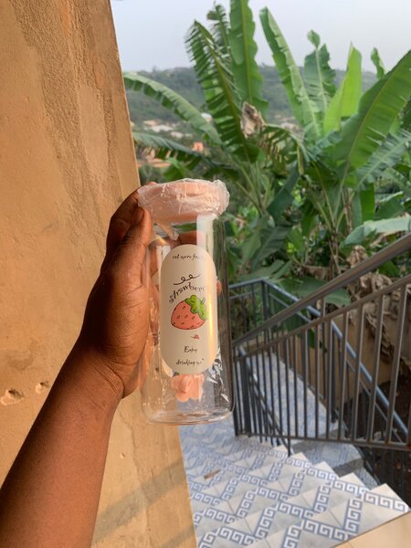 Glass bottle with straw