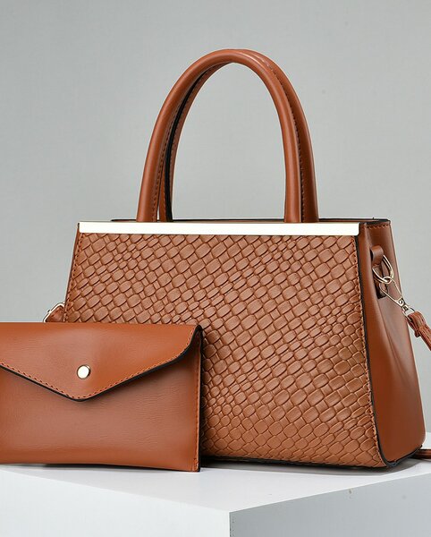 High-quality, stylish women's brown bag with an accessory