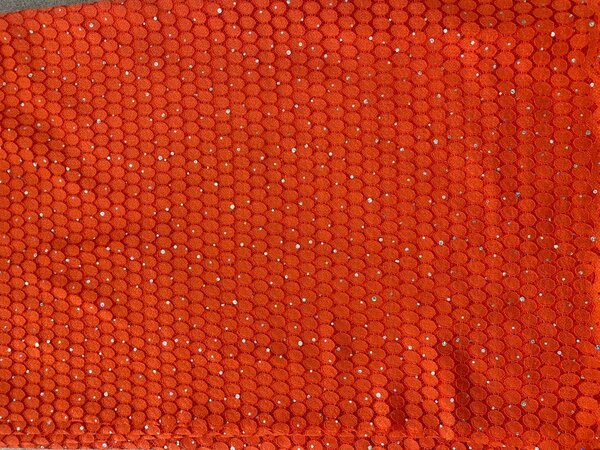 Tissu pailleté orange vif