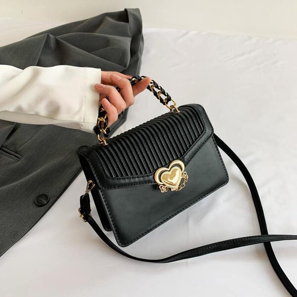 High-quality, stylish women's bag decorated with a heart