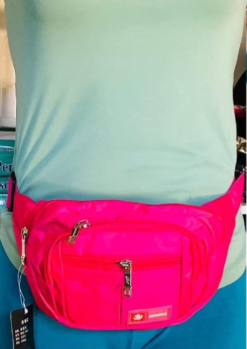Women's waist bag in bright pink color with several zippered pockets