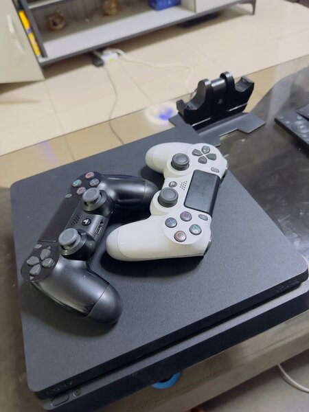 PlayStation 4 with 12 games including 2 original pads