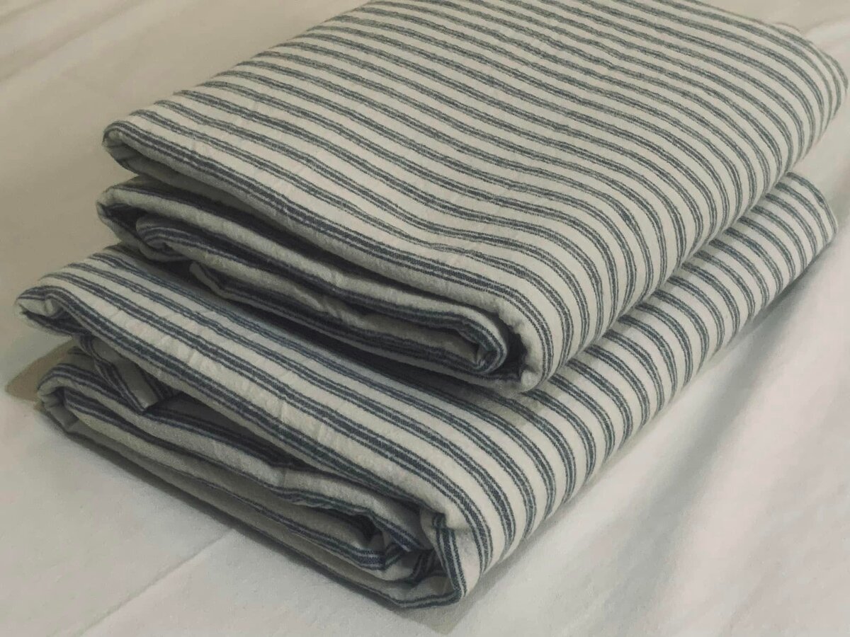 Grey striped bed linen.