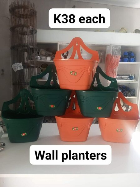 flower pots are mounted on the wall