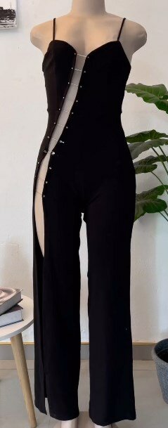Black jumpsuit with deep asymmetrical neckline