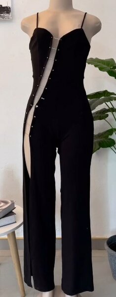 Black jumpsuit with deep asymmetrical neckline