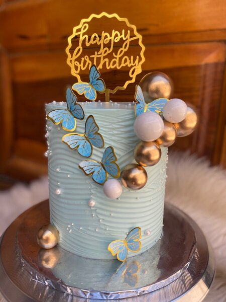 Vanilla and red velvet cake with faux balls and butterflies