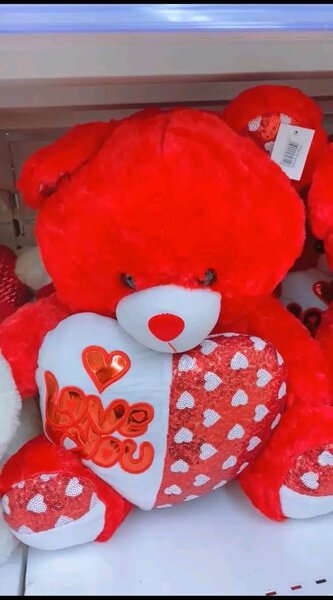 Ours en peluche rouge et blanc