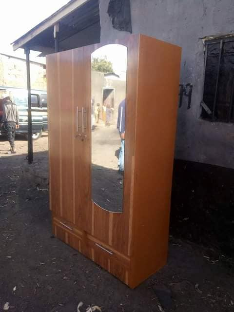 brown cabinet two lines with a mirror