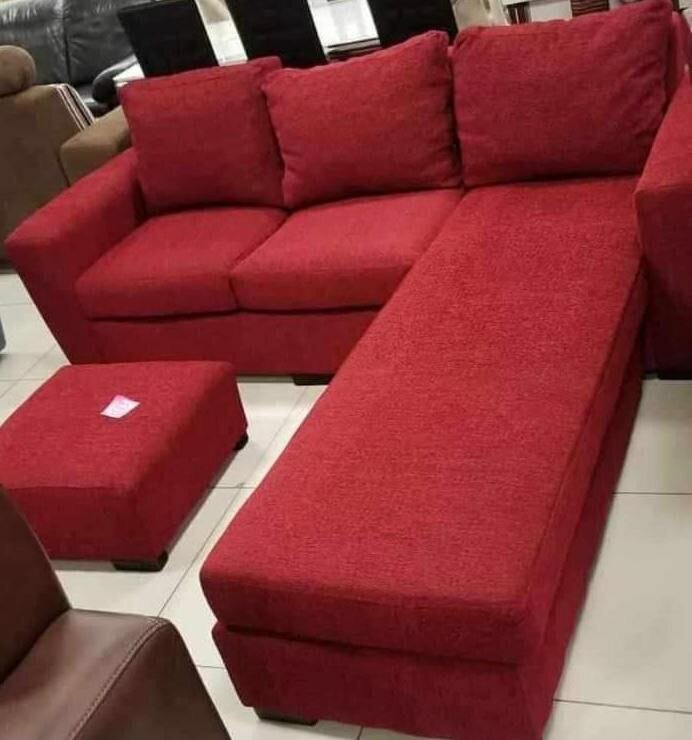 L-couch with throw pillows and footrest