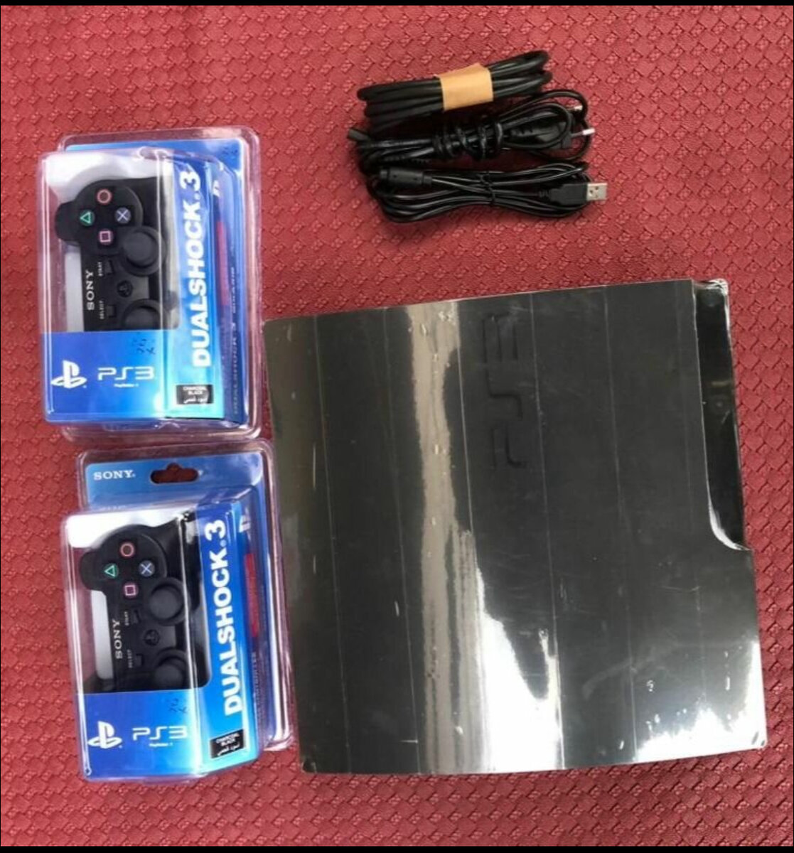 Console PS3 avec manettes