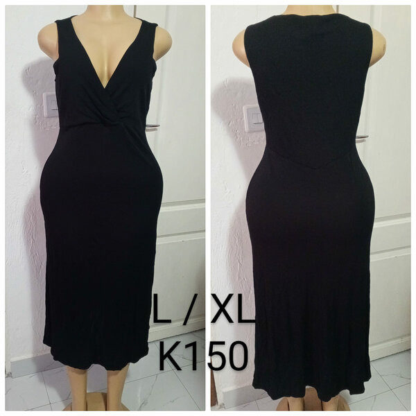 Women's black dress with a neckline, sizes L / XL
