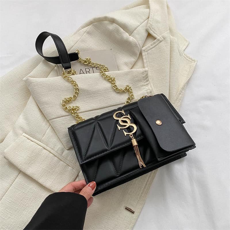 High-quality, stylish women's black bag with an accessory