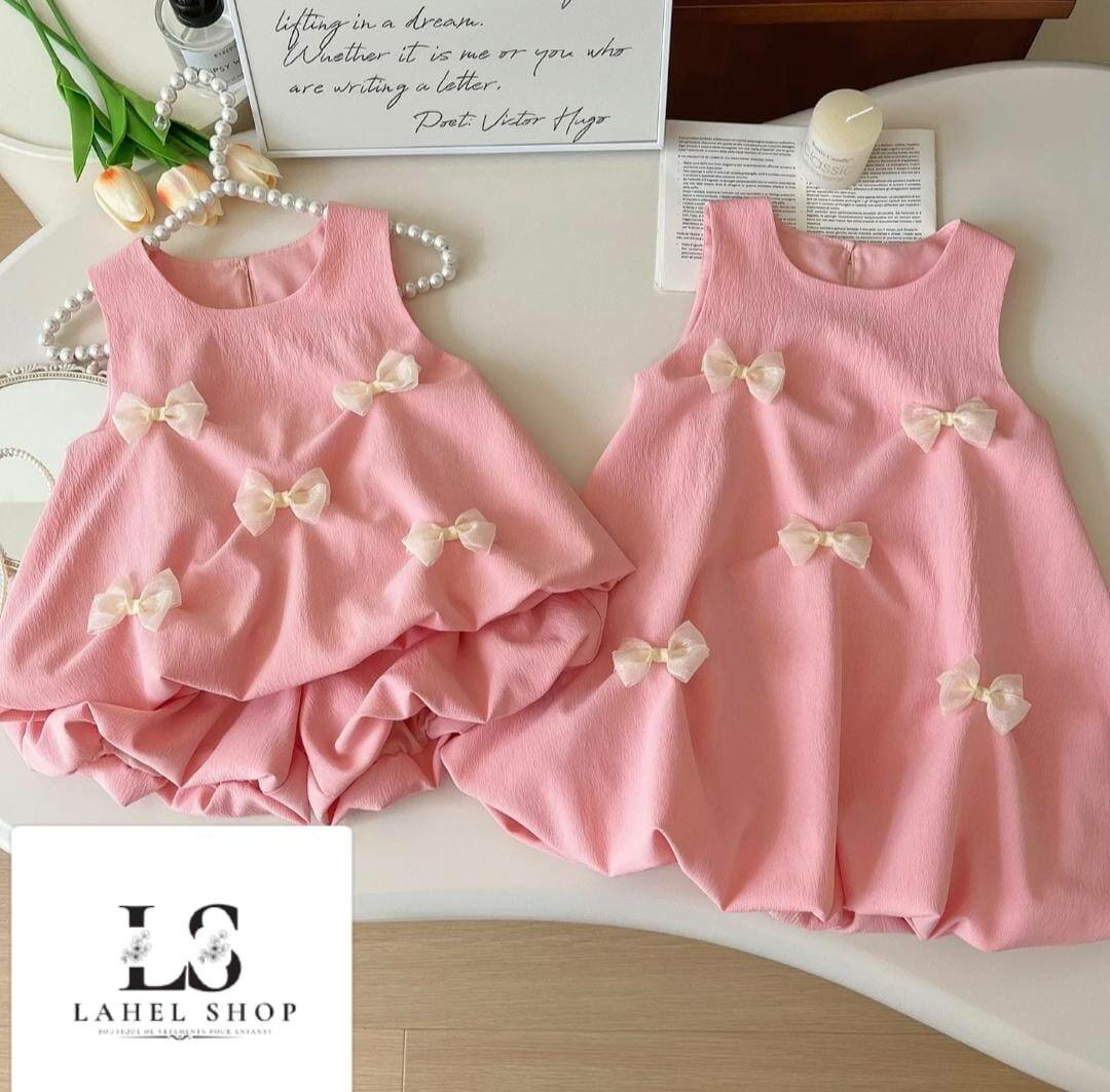 Robe rose à nœuds pour fille