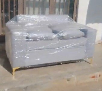 Gray two-seater sofa