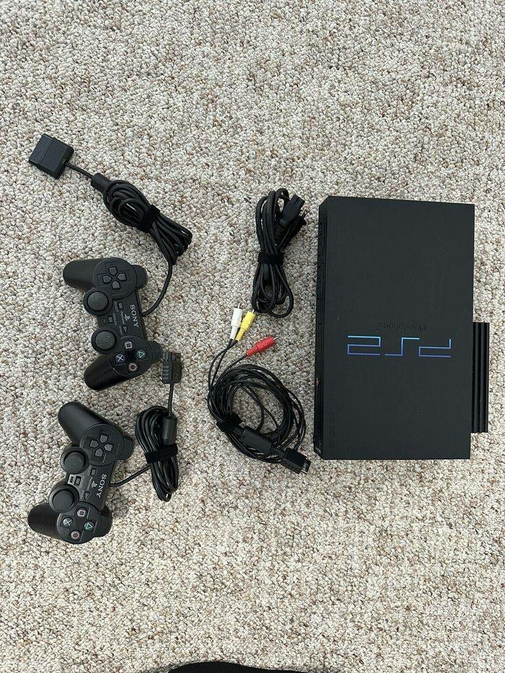 Sony PlayStation 2 Slim avec 2 manettes
