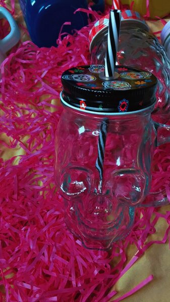 Glass jar with straw