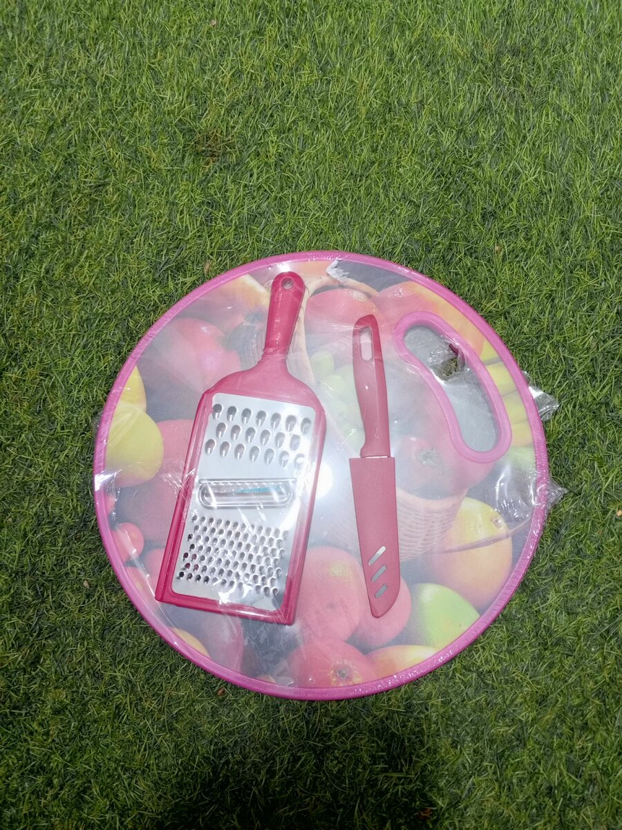 Chopping board, grater and knife