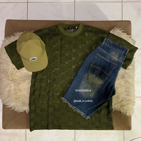 Net top, short jeans and a cap