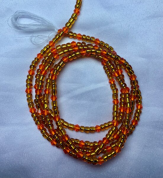 Baya en perles orange et noir