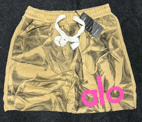 Shorts de sport Alo dorés