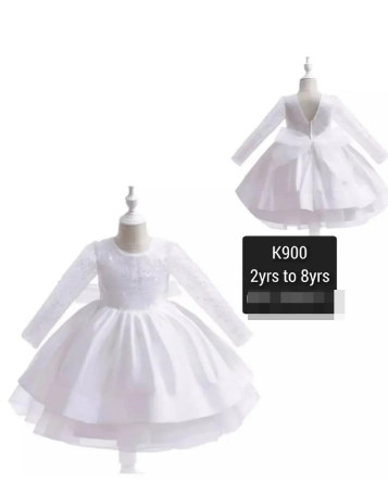 white dress with a bow at the back