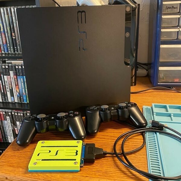 PS3 quasi neuve + 23 jeux et 2 manettes