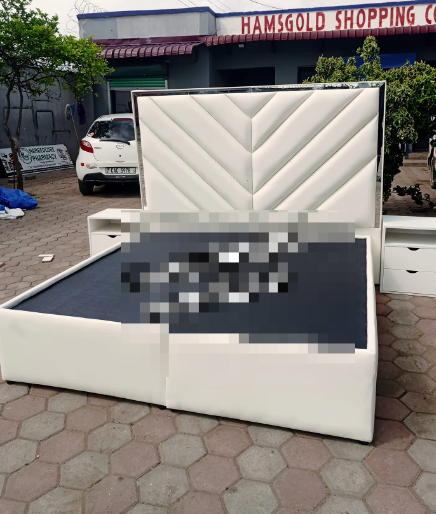 white bed with carved headboard