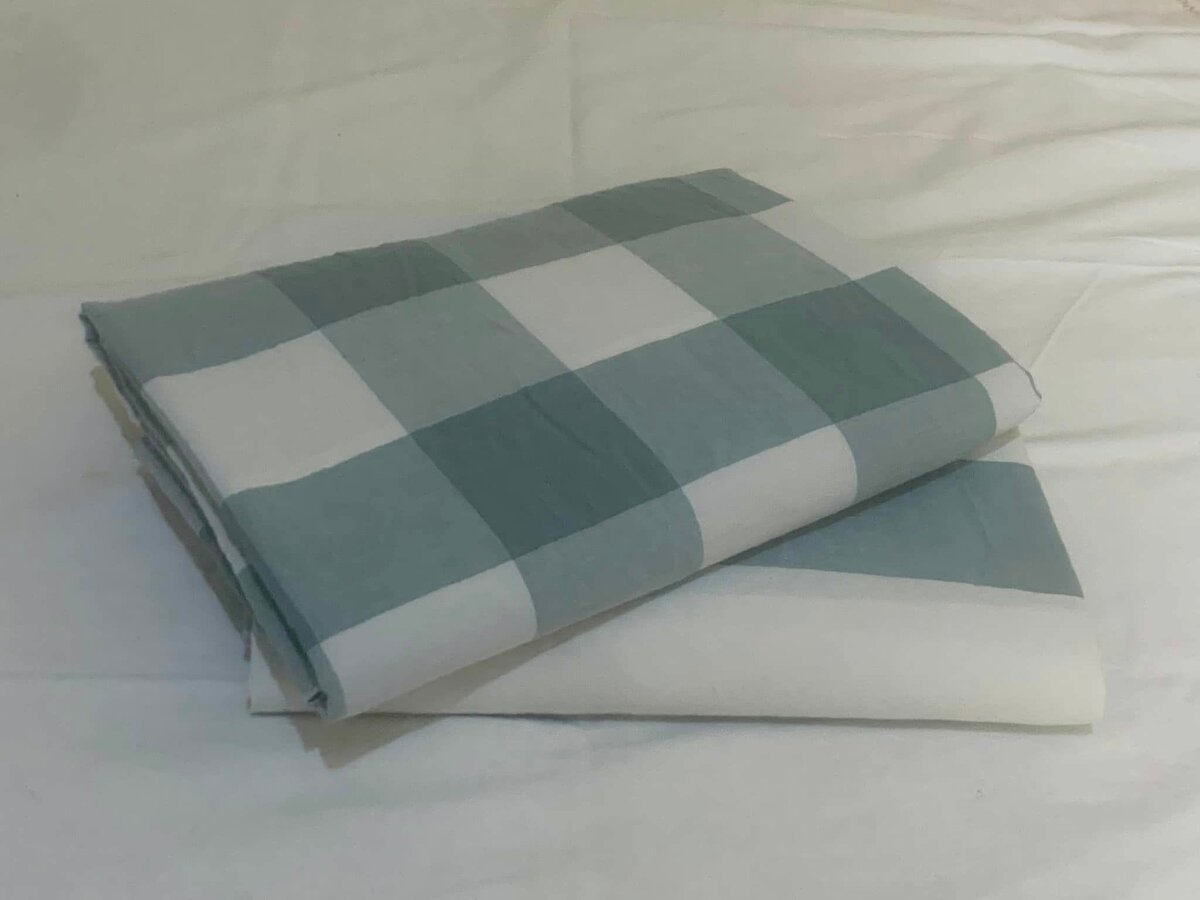 The bed linen is in a large cage.