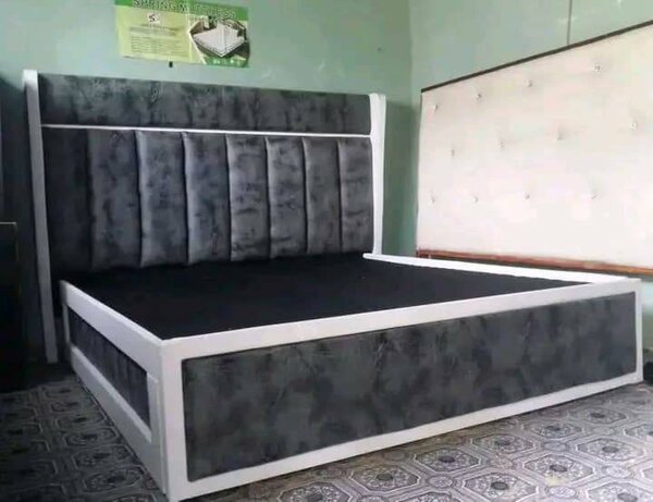 Headboard,side drawers,bed, and an ottoman