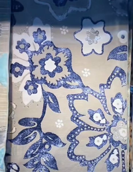 Carpet with blue floral pattern on beige background