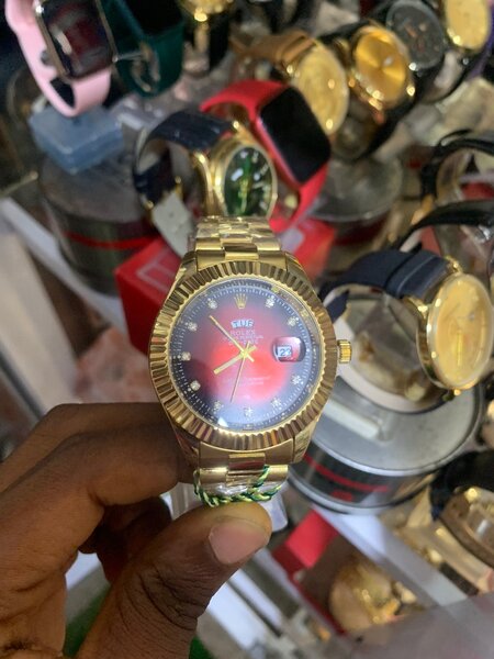 Rolex gold with red face