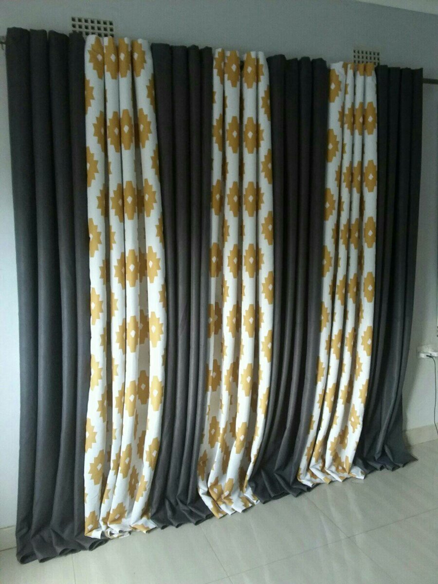 2 drops of curtains black and white with orange patterns