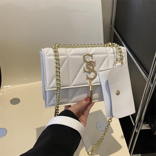 High-quality, stylish women's white bag with an accessory