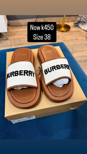 white and brown burberry flip-flops