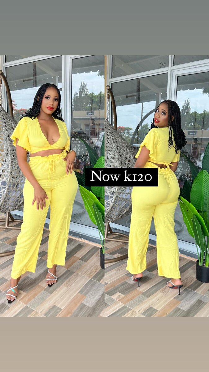 Yellow suit, trousers and a low-cut top