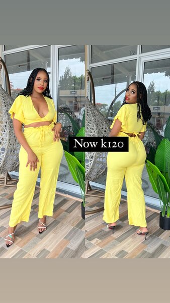 Yellow suit, trousers and a low-cut top