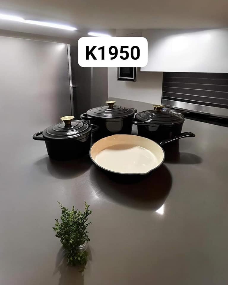 Three black pots and a frying pan for cooking