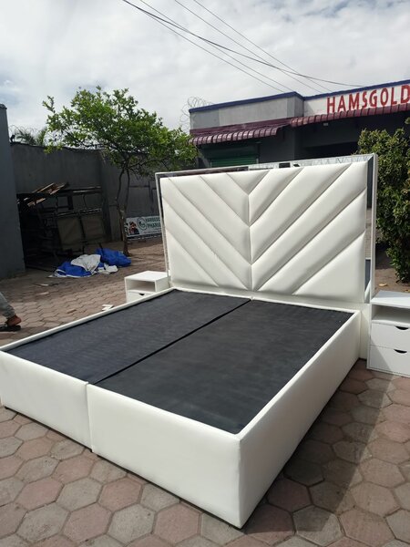 white bed with carved headboard